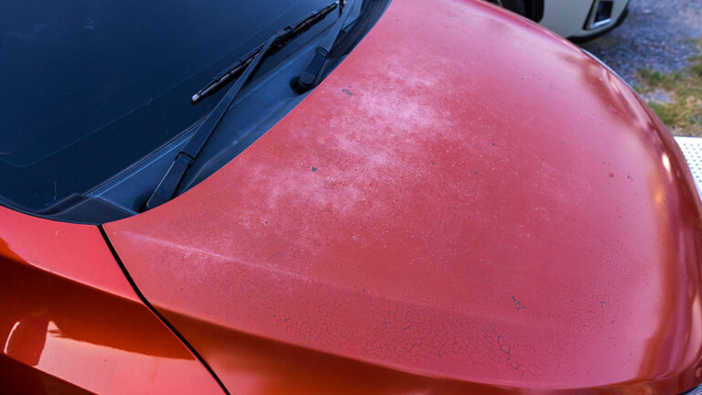 Car hood scratched with deep damage to the paint. Dent car scratch.