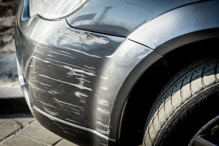 Scratches on the car bumper after a small accident.