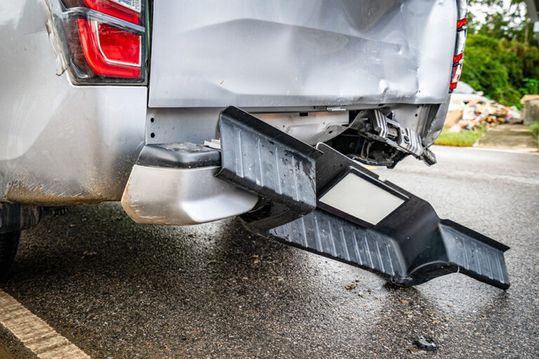 Rear-end collision damage to a vehicle trunk and bumper that may affect hatch alignment and weather sealing